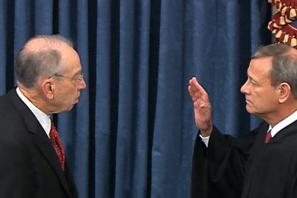 President Pro Tempore of the Senate Senator Chuck Grassley swears in Supreme Court Chief Justice John Roberts as the presiding officer for the impeachment trial of President Donald Trump.
