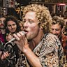 SUNHERALD- Crowds of people inundated the streets of Byron Bay after Splendour in the Grass festival cancelled its first day due to bad weather. People waited in long queues to enter venues. Photo shows local band The Seeding entertaining crowds on the streets. The buskers played for eight hours to keep the swelling crowd amused.Friday July 22nd Photo by Natalie Grono