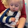 Delilah Lewis with her broken arm in 2023.