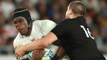 Supreme: Maro Itoje of England is tackled by replacement hooker Dane Coles of New Zealand.