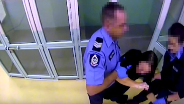The woman pleaded with the officers that she wasn't faking her pain.