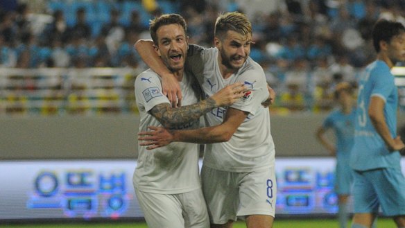 Adam Taggart celebrates with debutant Terry Antonis after the latter set up a goal for the former against Daegu last year.