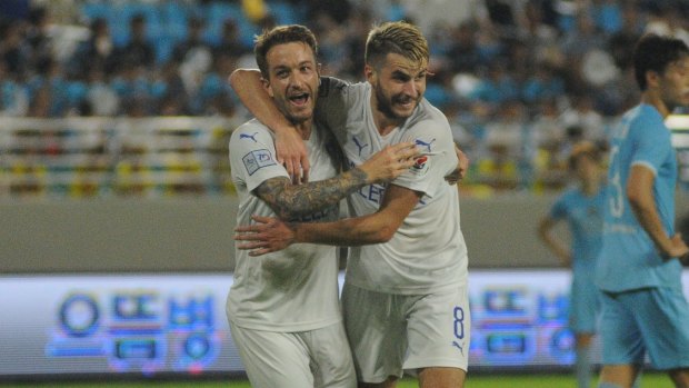 Adam Taggart celebrates with debutant Terry Antonis after the latter set up a goal for the former against Daegu last year.