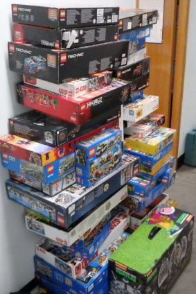 More than 50 boxes of Lego are among allegedly stolen goods seized by police at a unit in Queanbeyan on Sunday morning.