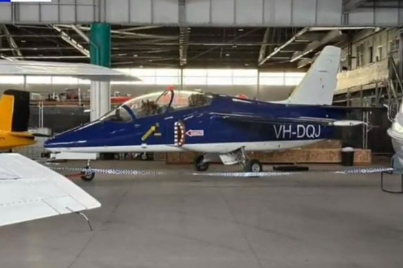 The other S211 jet in its hanger, behind police tape, in Essendon on Sunday afternoon.
