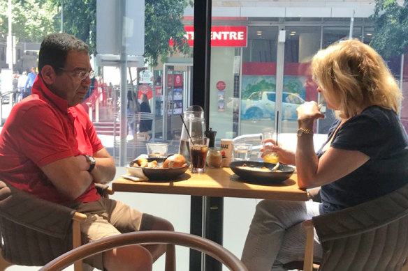 A surveillance photo taken by IBAC investigators of councillor Sam Aziz meeting former Liberal Party MP Lorraine Wreford in a city cafe. She later gave him cash she acknowledged was a bribe.
