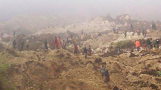Villagers search the site of a  landslide that struck villages in the Southern Highlands mountainous region of central Papua New Guinea a few years ago.