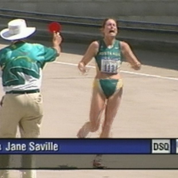 wlk000928.001.003.jpg  Jane Saville being disqualified by an official from the walking race during the 2000 Sydney Olympics. The official holds up the red card.
***FDCTRANSFER***