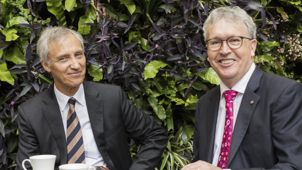 University of Wollongong Vice Chancellor Professor Paul Wellings (red tie) with Ramsay Centre CEO, Professor Simon Haines, after a deal signing on a university to the Ramsay Centre for Western Civilisation. 