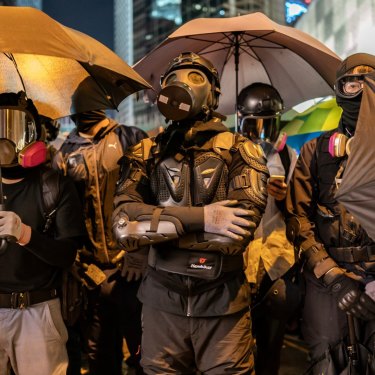 Protesters form a front line during a stand-off with police in December 2019. 