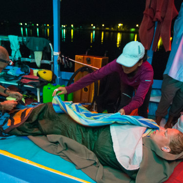 McCardel recovering on a boat after her 124-kilometre Bahamas swim – involving 41 hours straight in the water – in 2014. 