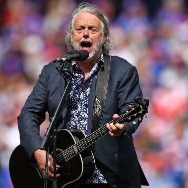 Mike Brady performs One Day in October during the 2016 AFL grand final.