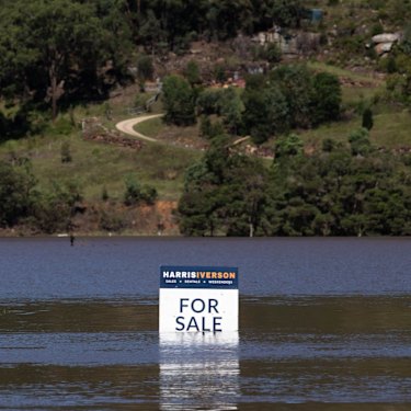 A For Sale sign for a flood inundated property on the Macdonald River, near Wisemans Ferry this week. 
