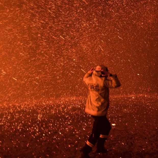 Firefighters run for safety as the Green Wattle Creek fire explodes into a sudden ember storm in Orangeville in December 2019, as captured in this award-winning photo by Nick Moir.