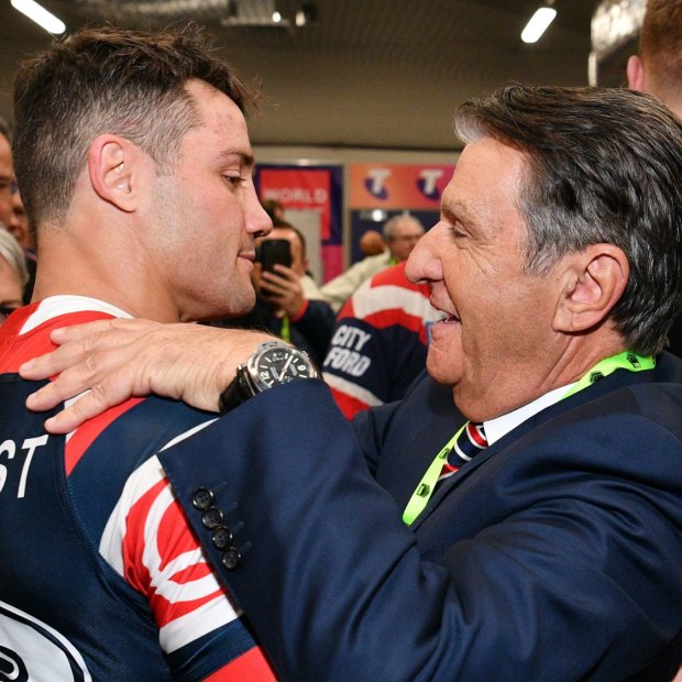 Politis celebrates the Roosters’ 2018 grand final win with Cooper Cronk.