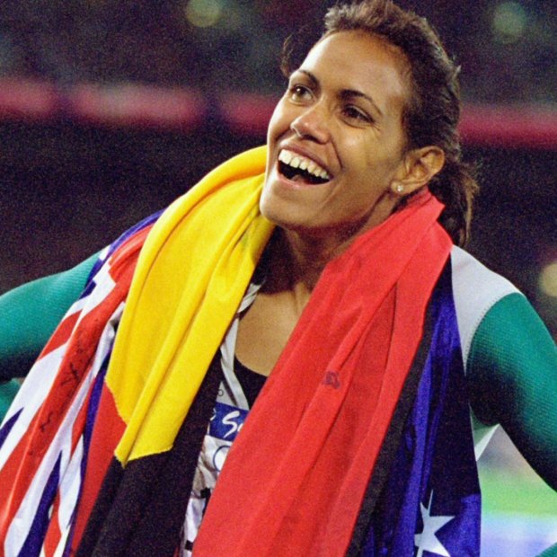 Cathy Freeman celebrates winning gold at the Sydney Olympics.