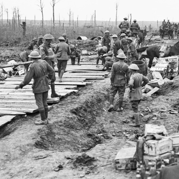 Members of the 2nd Australian Pioneer Battalion build a wagon track from planks at Chateau Wood in Belgium. 