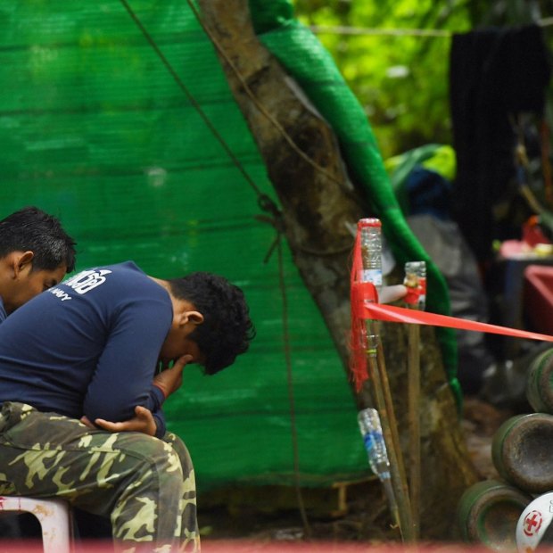 Thai navy personnel at the base camp at Tham Luang cave, the day after a former Thai navy seal died in the rescue efforts. 