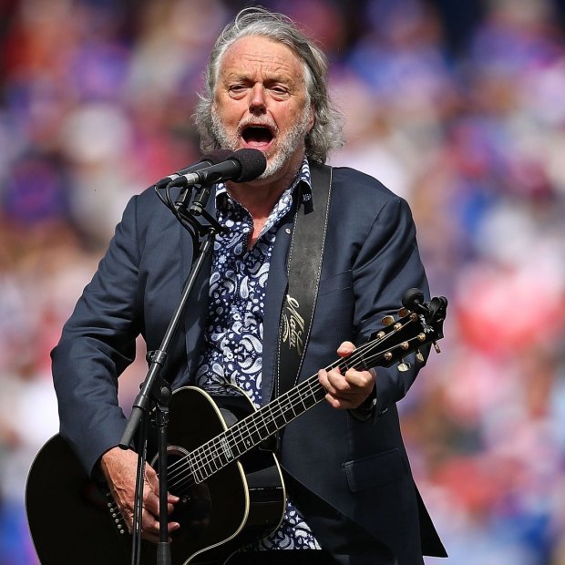 Mike Brady performs One Day in October during the 2016 AFL grand final.