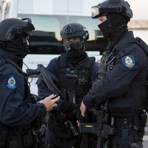 Australian Border Force and police officers conduct a drug raid last year.