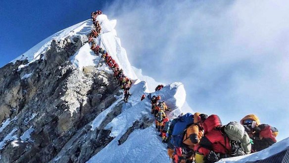 A picture by climber Nirmal Purja shows heavy traffic of mountain climbers lining up to stand at the summit of Mount Everest. 