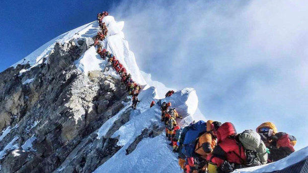 A picture by climber Nirmal Purja shows heavy traffic of mountain climbers lining up to stand at the summit of Mount Everest. 