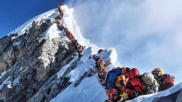 A picture by climber Nirmal Purja shows heavy traffic of mountain climbers lining up to stand at the summit of Mount Everest. 