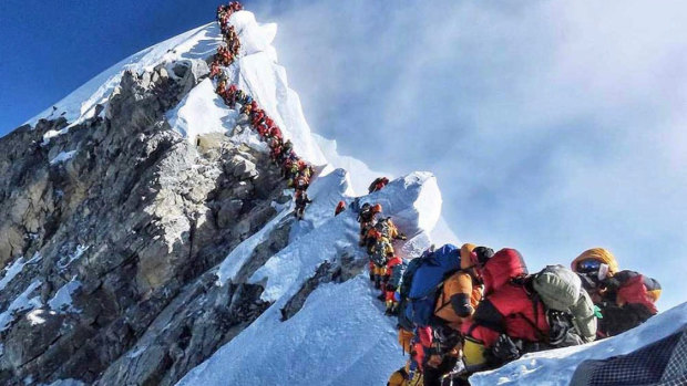 A picture by climber Nirmal Purja shows heavy traffic of mountain climbers lining up to stand at the summit of Mount Everest. 