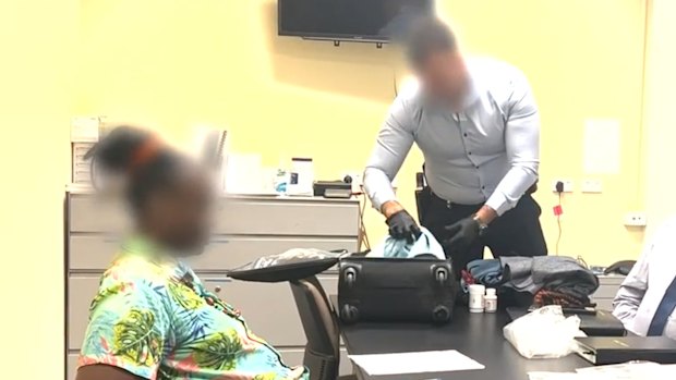 A woman has been arrested and charged after allegedly luring people to Australia with the promise of fake scholarships.