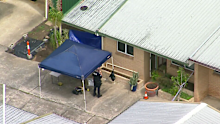 Police at the scene in Woodridge on Tuesday.