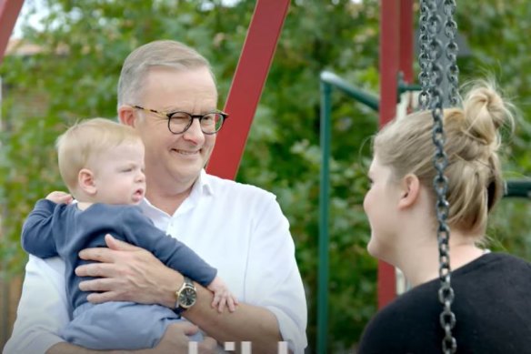 Albanese takes time out to corner a mother and child in a playground.