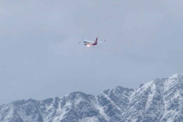 A Qantas plane bound for Queenstown in New Zealand has been diverted to Christchurch after flames appeared to sputter from the engine.A Qantas plane bound for Queenstown in New Zealand has been diverted to Christchurch after flames appeared to sputter from the engine.