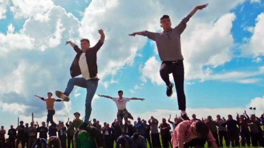 A cheery scene from the Chinese Communist Party Xinjiang musical “The Wings of Songs”. 