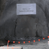 Eileen breaks through a cavern wall after boring a six-kilometre tunnel.