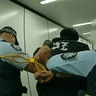 New Zealand man arrested after a flight lands in Melbourne, Australia.