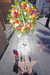 Flowers and mementoes adorned the star of Dennis Hopper on the Hollywood Walk of Fame in 2010 following his death.
