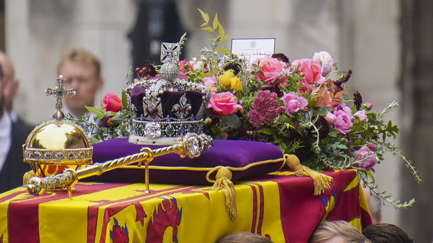 The coffin of Queen Elizabeth II is placed on a gun carriage during her funeral service in Westminster Abbey.
