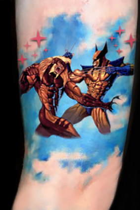 Jonathan Dick's Wolverine v Sabre-tooth tattoo.