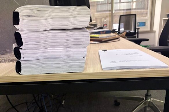 Colleen Harkin says the left pile is Australia’s maths curriculum and the right pile is Singapore’s.