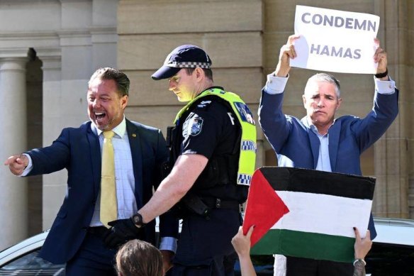 MPs Nick Dametto and Robbie Katter confronted protesters at a rally outside Queensland parliament.