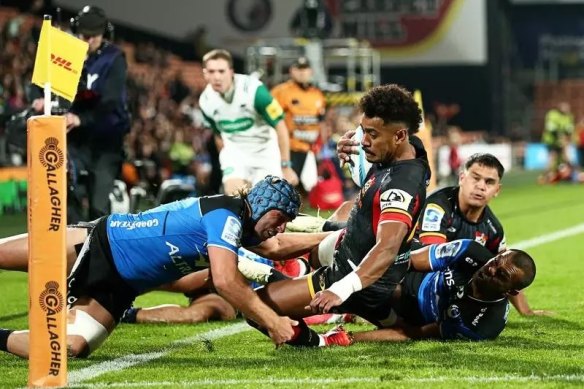 Winger Emoni Narawa scores one of the Chiefs’ nine tries against the Western Force.