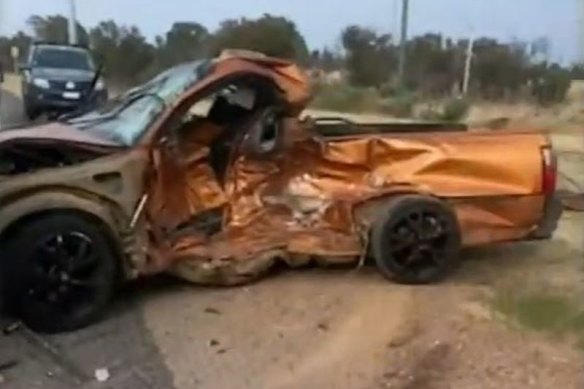 An orange Holden resembled a mangled wreck after a crash in Oakford, Perth in the early hours of Saturday morning.