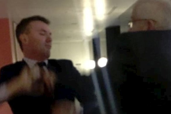 Pauline Hanson adviser James Ashby, left, and Senator Brian Burston in an  altercation at Parliament House.