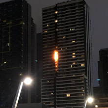 A fire fuelled by flammable cladding races up the side of Spencer Street's Neo200 tower in February. SOURCE: 3AW
