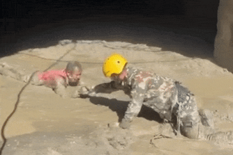 Soldiers rescue survivors at the hydropower plant.