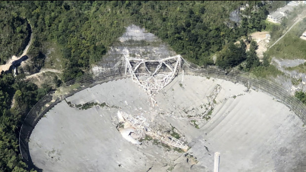 The collapsed radio telescope in Arecibo, Puerto Rico.