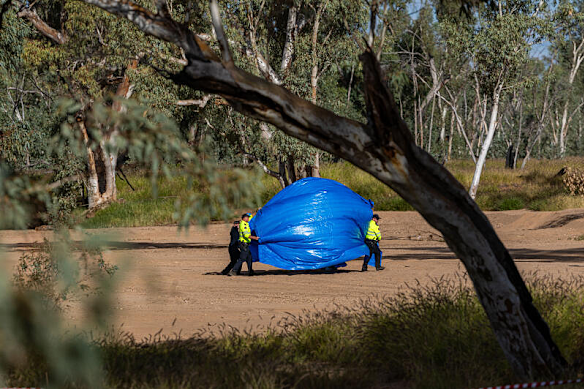 Police at the crime scene on Thursday afternoon. 