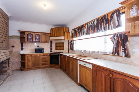 The old kitchen, which featured a fireplace which also opened into the living room. 