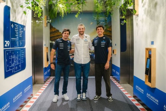 Atlassian chief executive and co-founder Mike Cannon-Brookes (centre) with Williams F1 race drivers Carlos Sainz Jr (L) and Alex Albon (R)