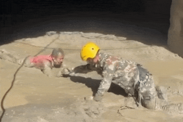 Soldiers rescue survivors at the hydropower plant.